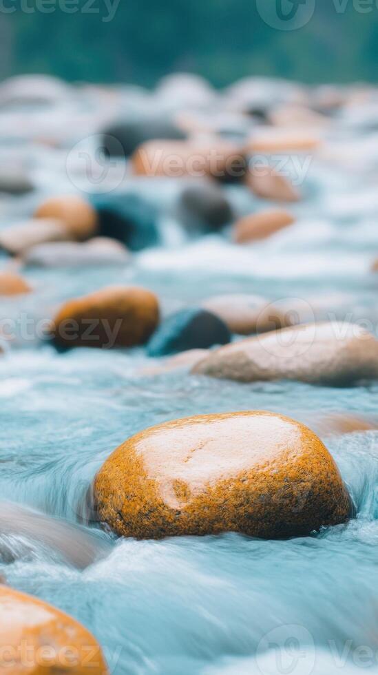 Vertical View of a Streaming River Over Stones in a Calm Natural Setting with Smooth Pebbles and Flowing Water Ideal for Tranquility, Relaxation, and Nature Scenes in Stock Photography photo