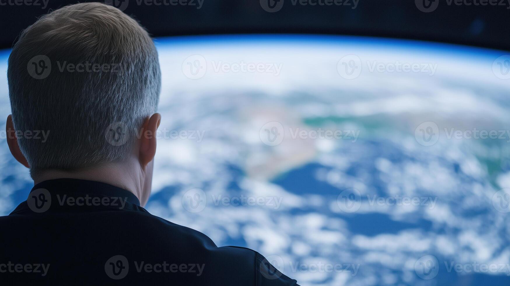 Person observing Earth from space through a large window with a blurred planetary view Space exploration and observation concept focusing on human connection with the planet photo