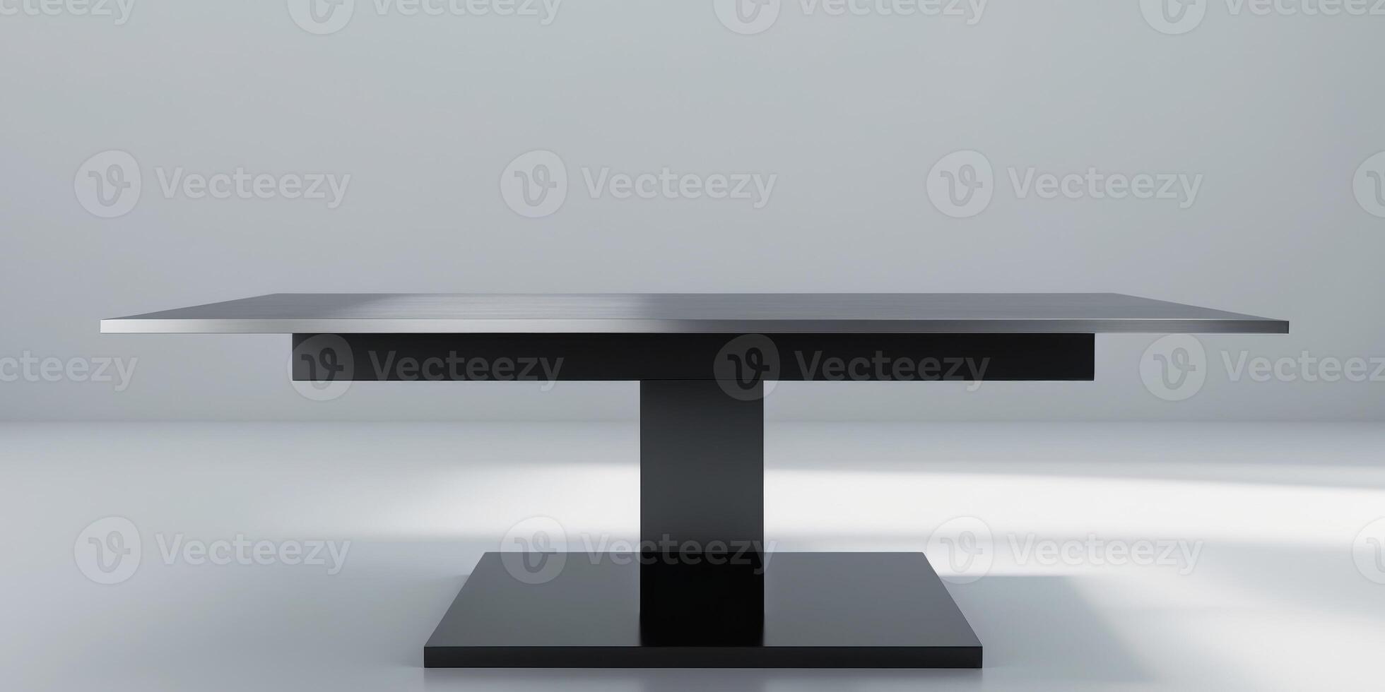A metal table with a black base and a silver top photo