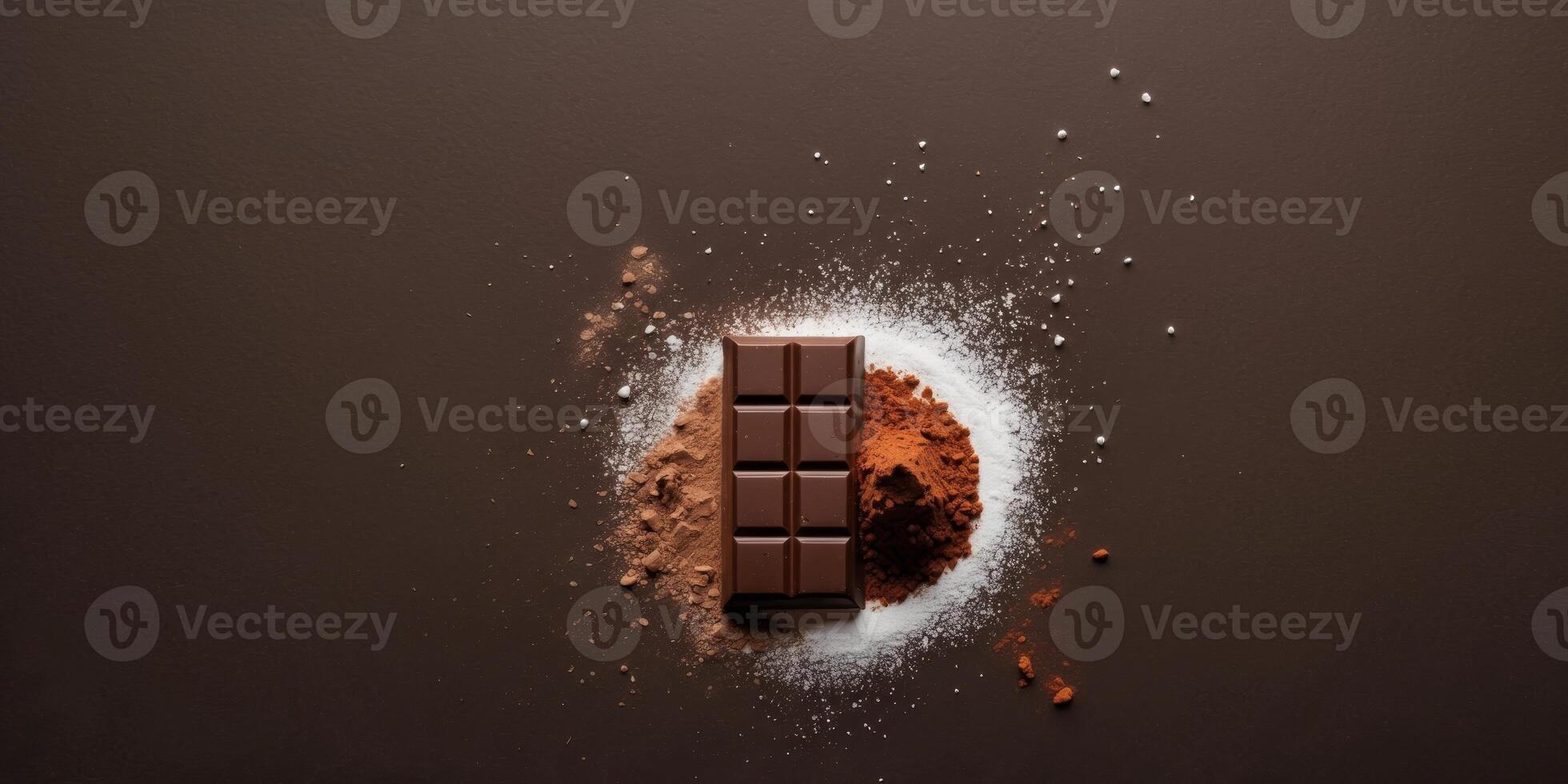 chocolate bar with white powder and cocoa powder on dark background photo