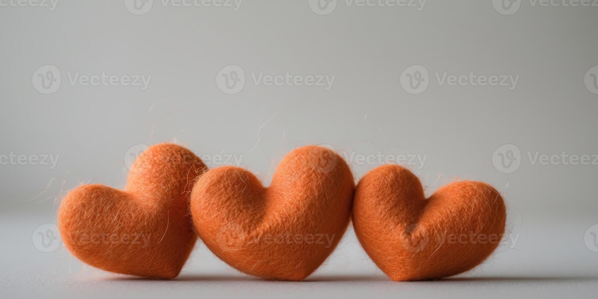 Three Orange Felt Hearts Row Close Up Valentine's Day photo