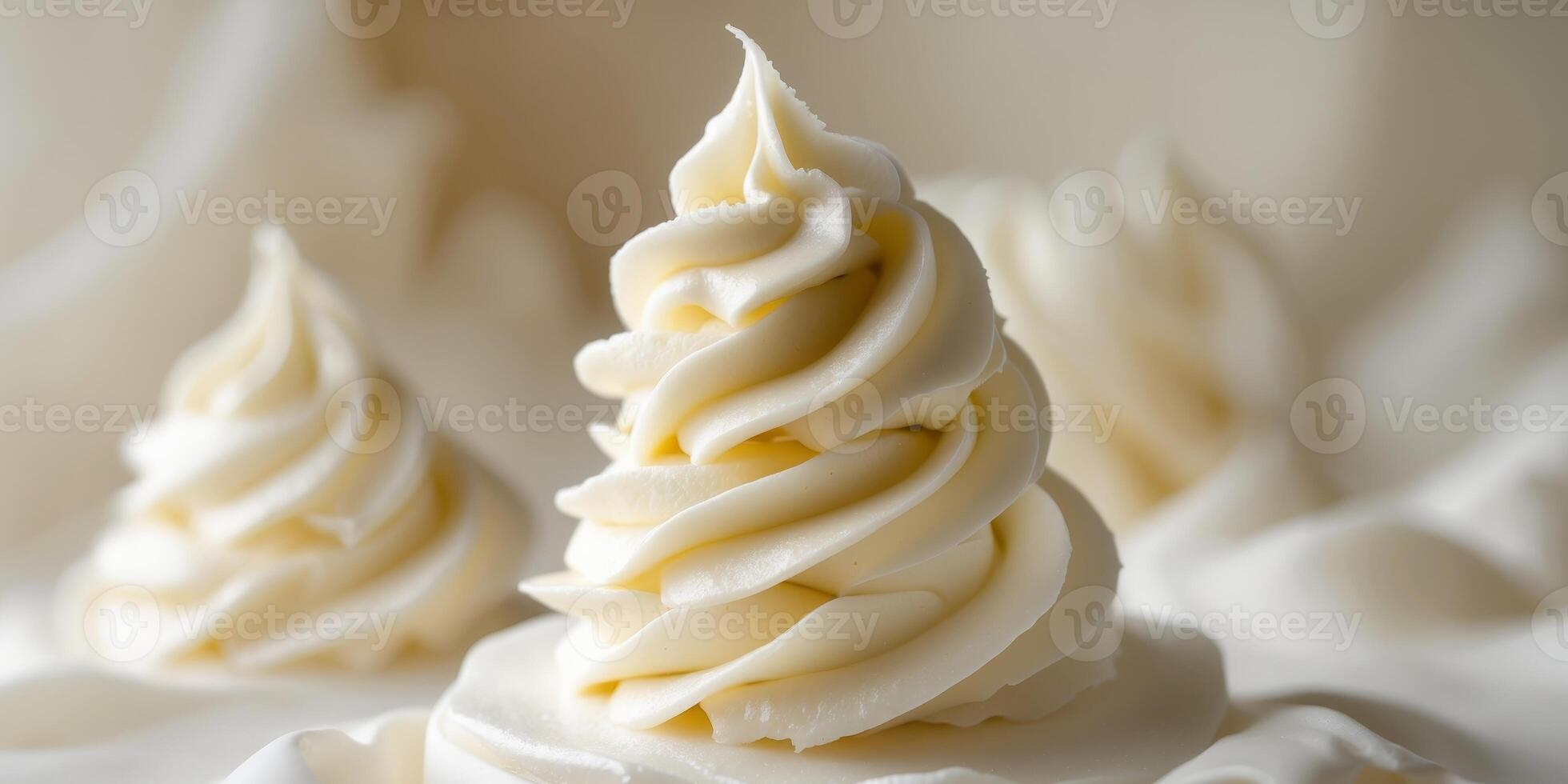 Swirls of creamy vanilla frosting on a light background photo