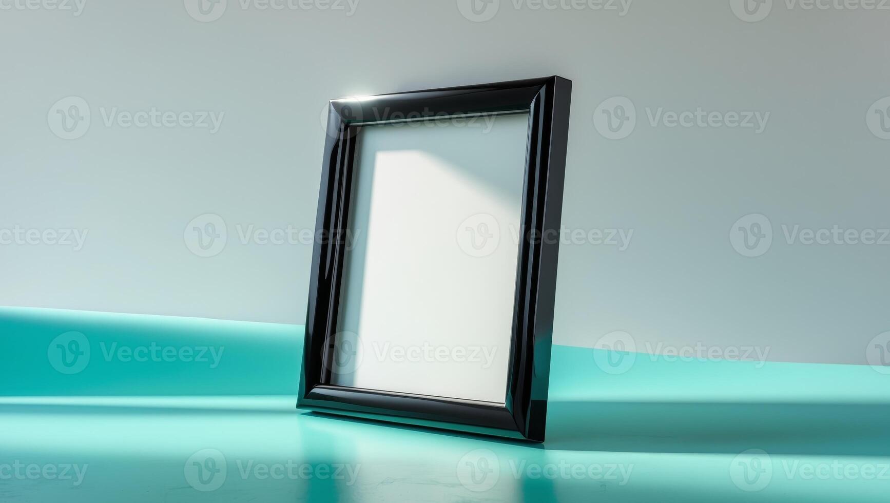 sleek black frame with blank canvas inside standing on smooth turquoise surfacesleek black frame with blank canvas inside standing on smooth turquoise surface. photo
