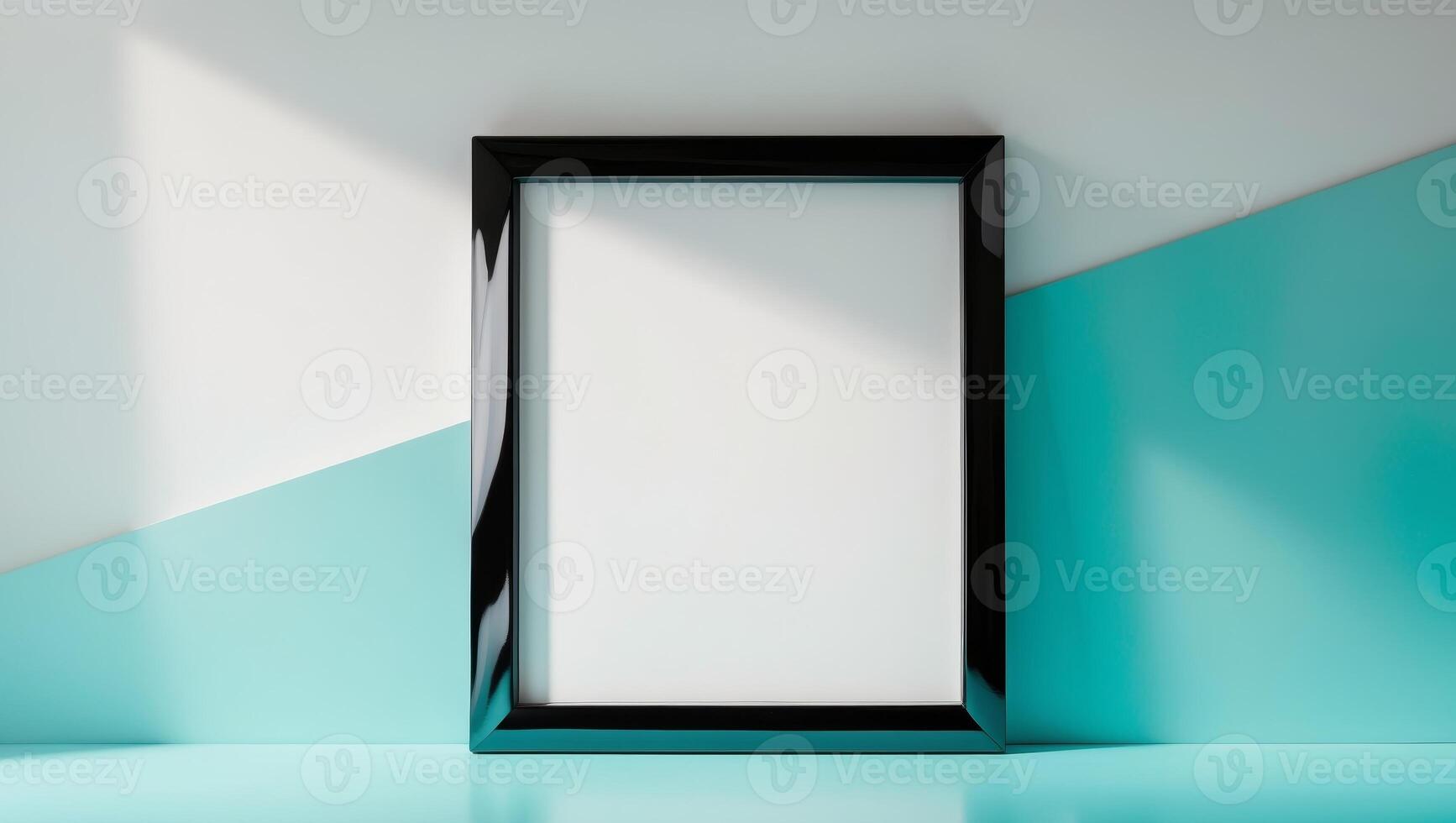 sleek black frame with blank canvas inside standing on smooth turquoise surface photo