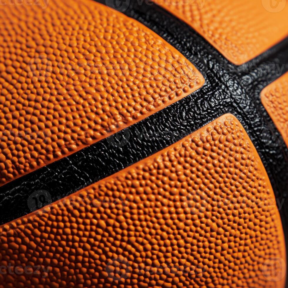 Close-up view of a basketball showing texture and detail in the orange surface and black lines photo