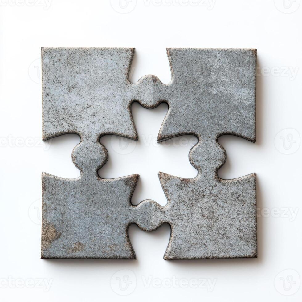 Metal puzzle pieces interlocked on a plain background creating an abstract design with a sense of completion photo