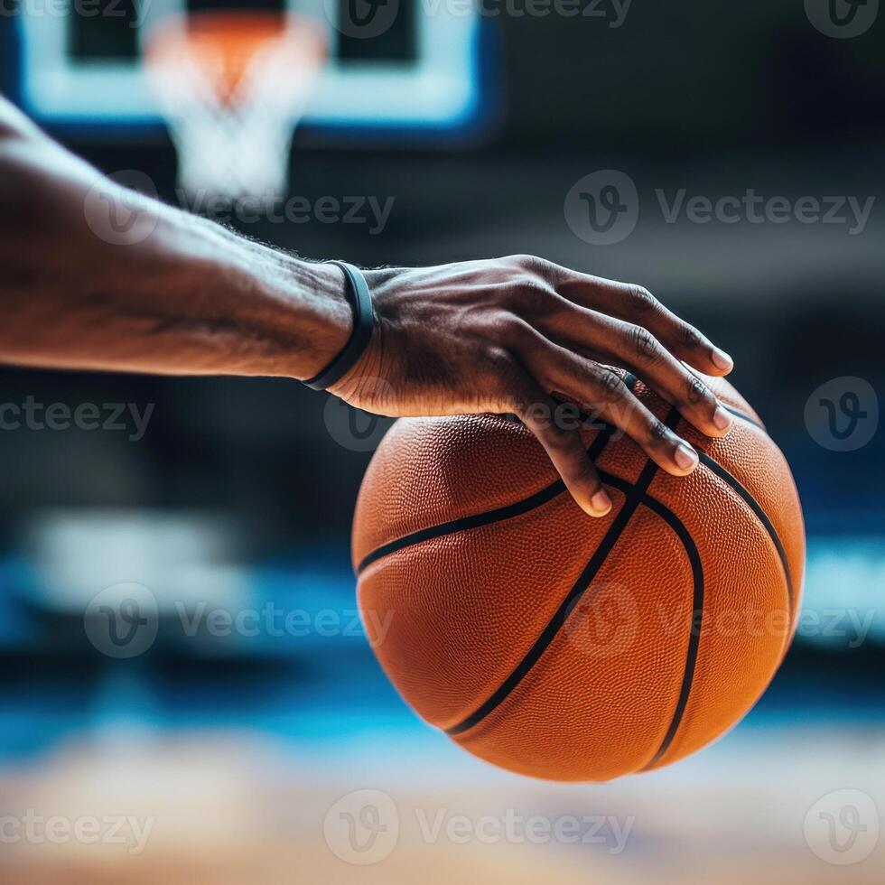 Close-up of a hand gripping a basketball before a crucial shot during an intense game at a sports arena photo