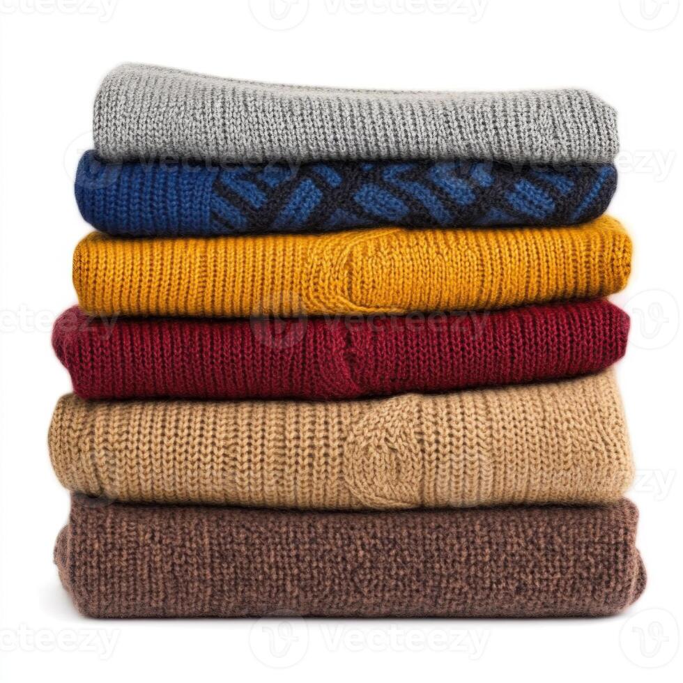 Warm and cozy stack of knitted sweaters displayed in an organized manner at a home setting during autumn photo