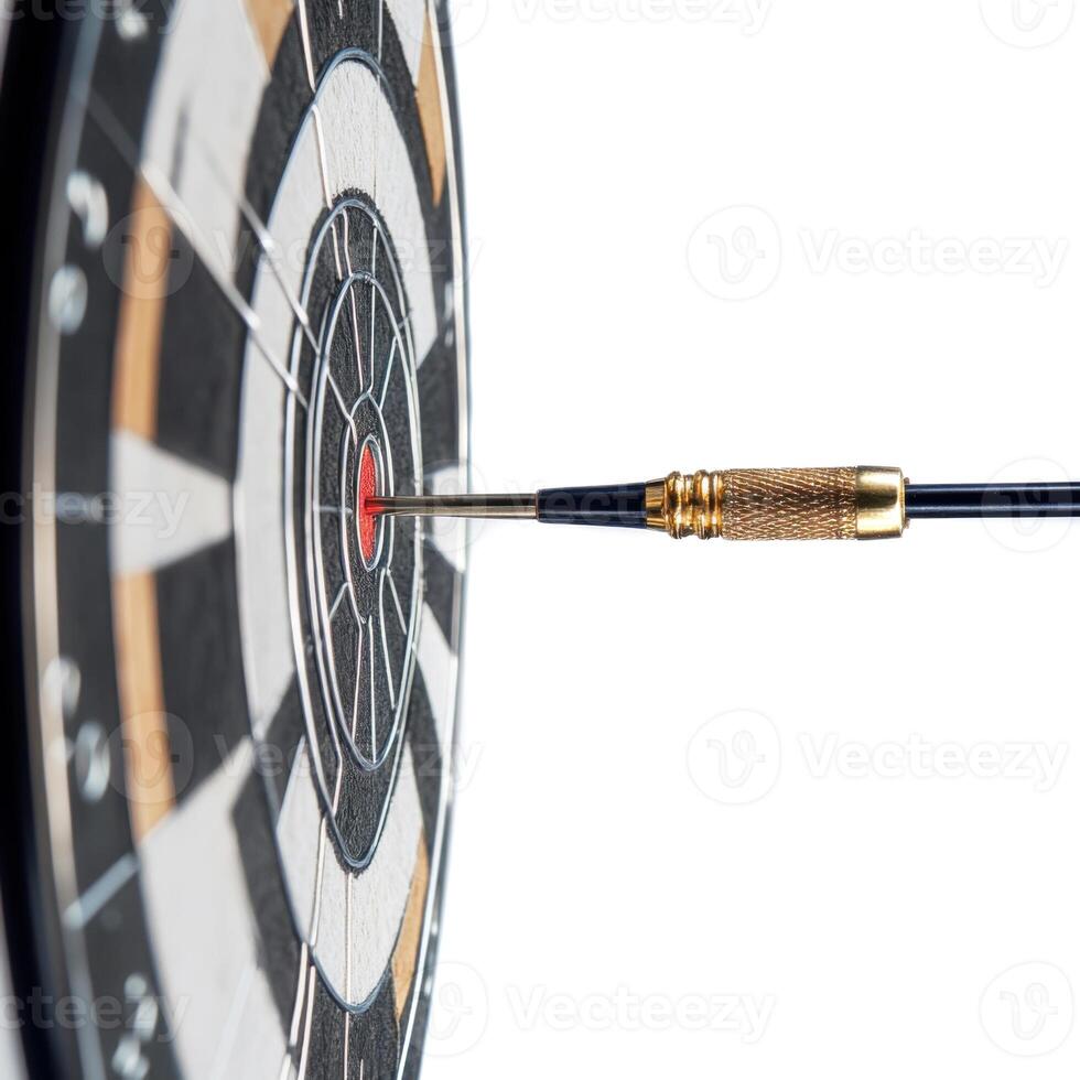Dart striking the bullseye on a dartboard in a well-lit indoor setting photo