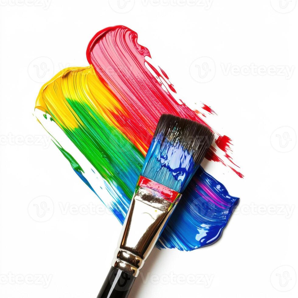 Vivid paint strokes and brush create a colorful artwork on canvas in a creative studio setting photo