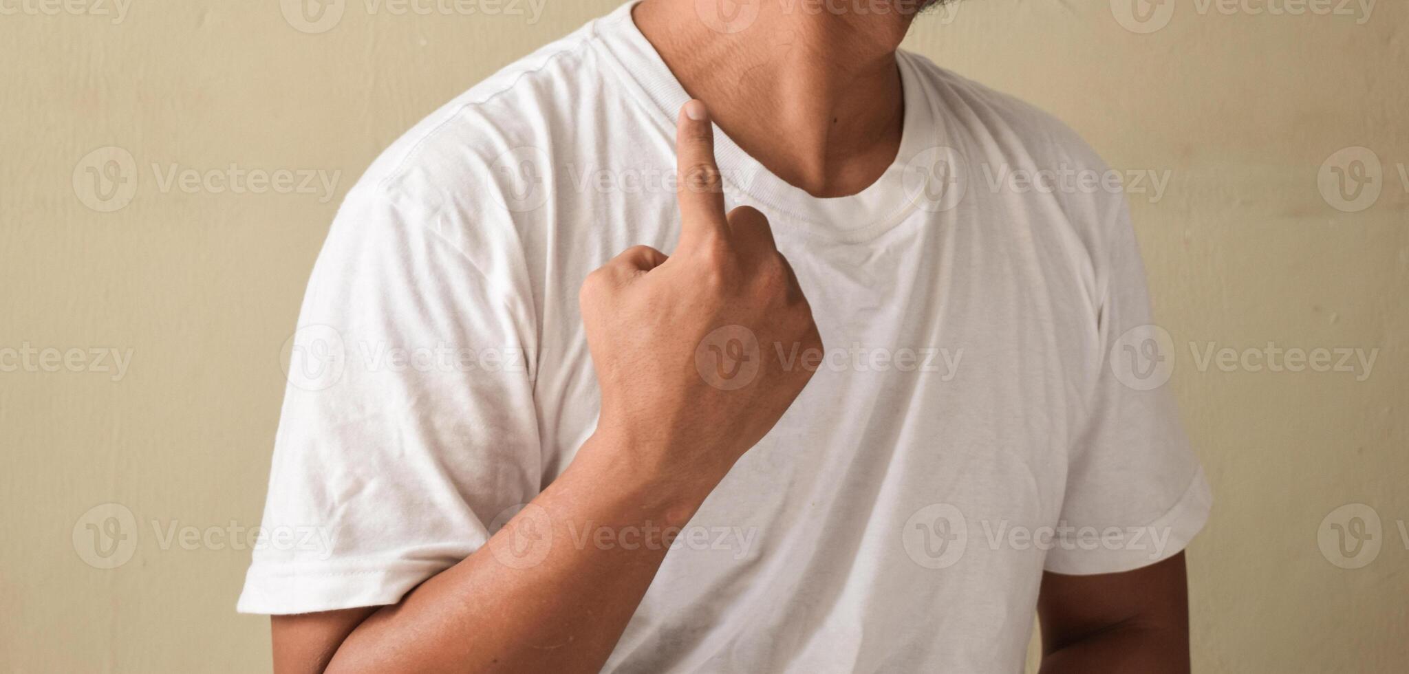 Young man showing gesture DEAF in sign language photo