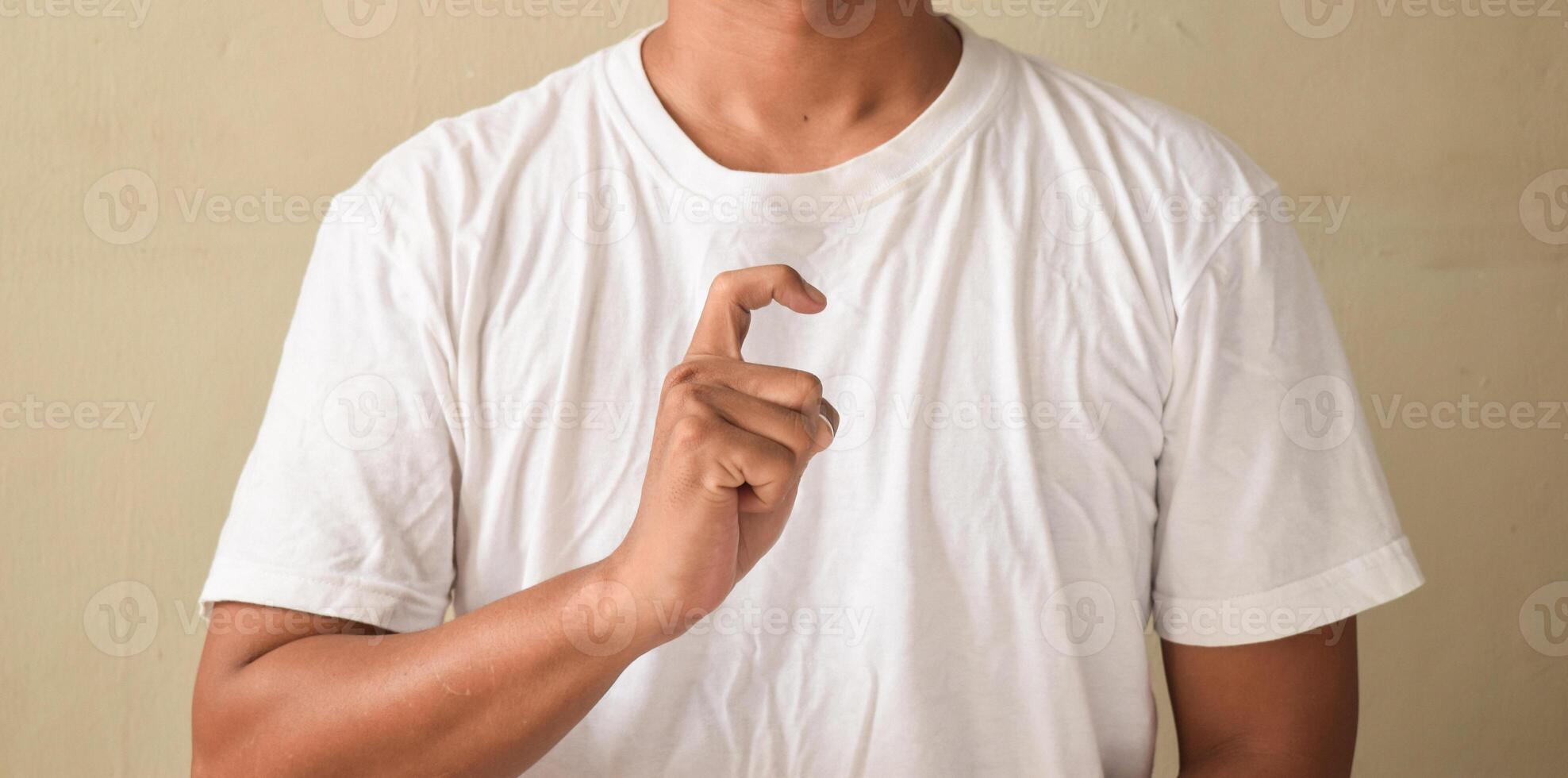 Young man showing letter X on sign language photo