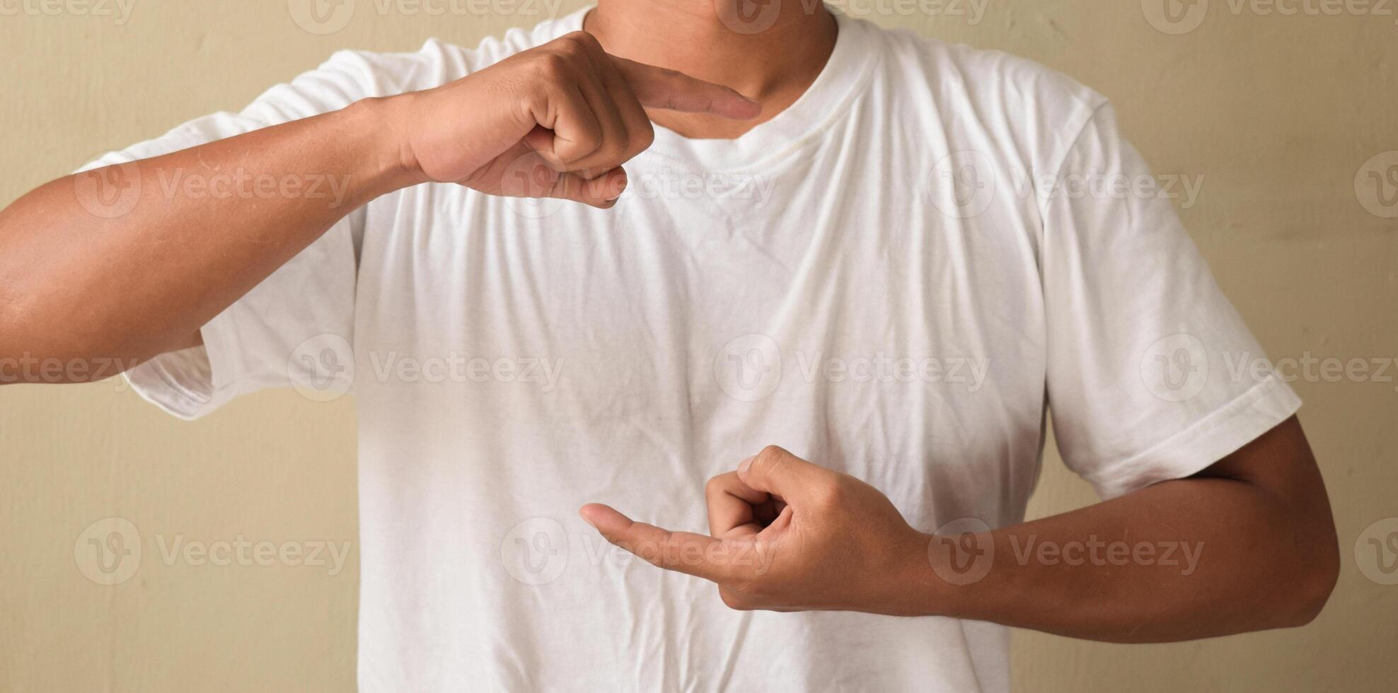 Young man make gesture hand about sign language to teaching to colleague photo