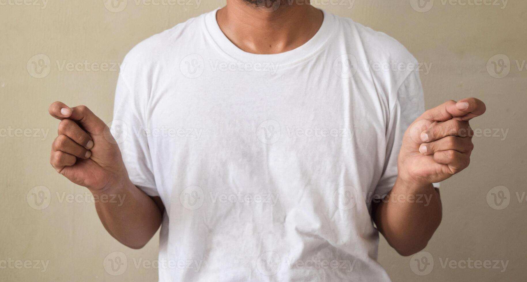 young man showing sign language with hand gestures photo