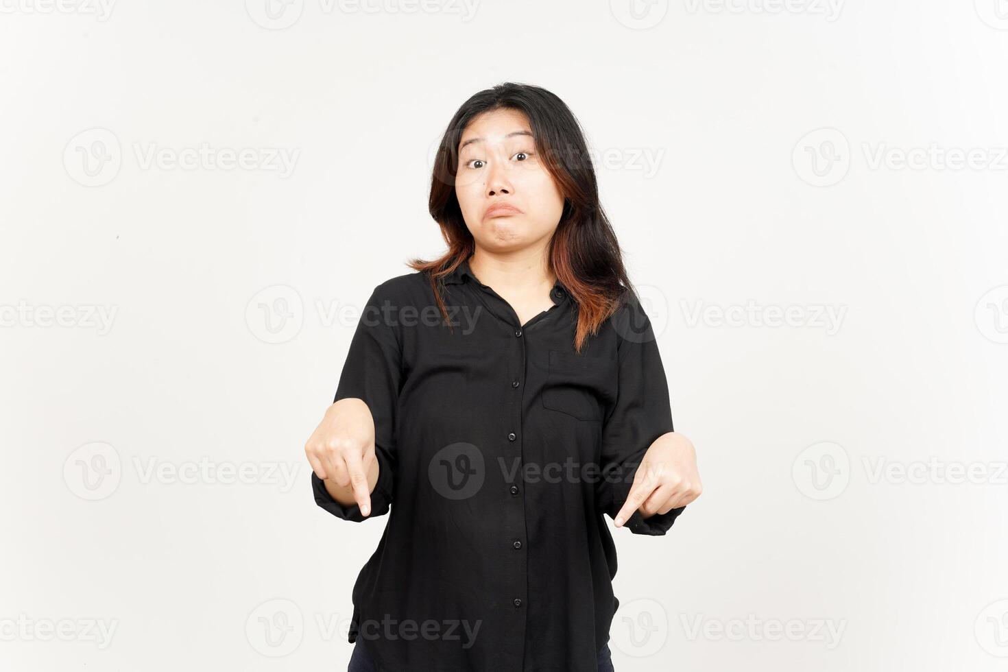 Pointing down and showing blank copy space of Beautiful Asian Woman Isolated On White Background photo