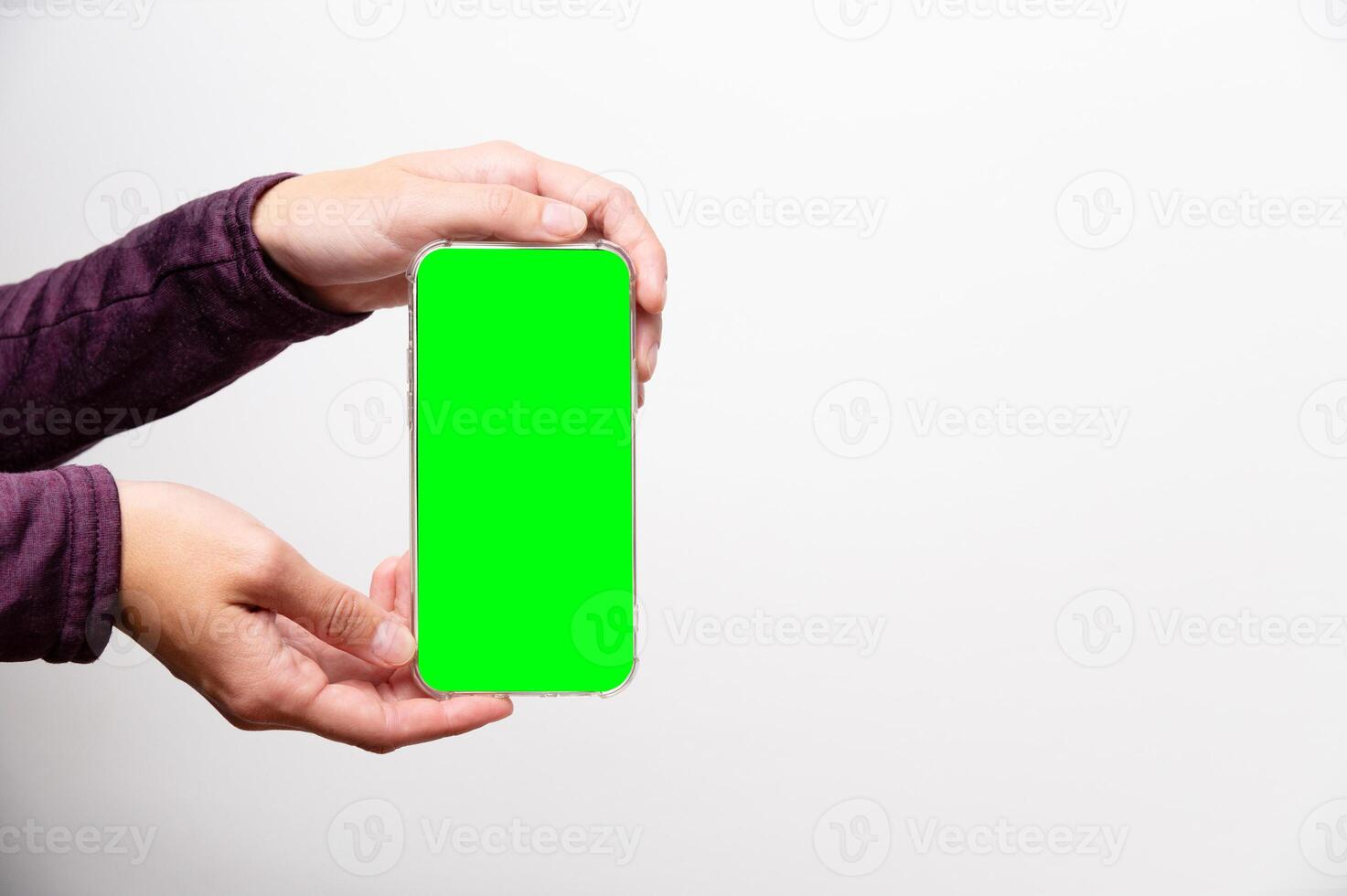 Close up of a woman's hand holding a modern smartphone mockup. New modern frameless smartphone mockup with blank screen. Modern smart photo