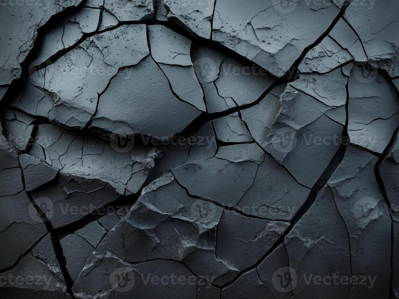 Textured black cracked surface background. photo
