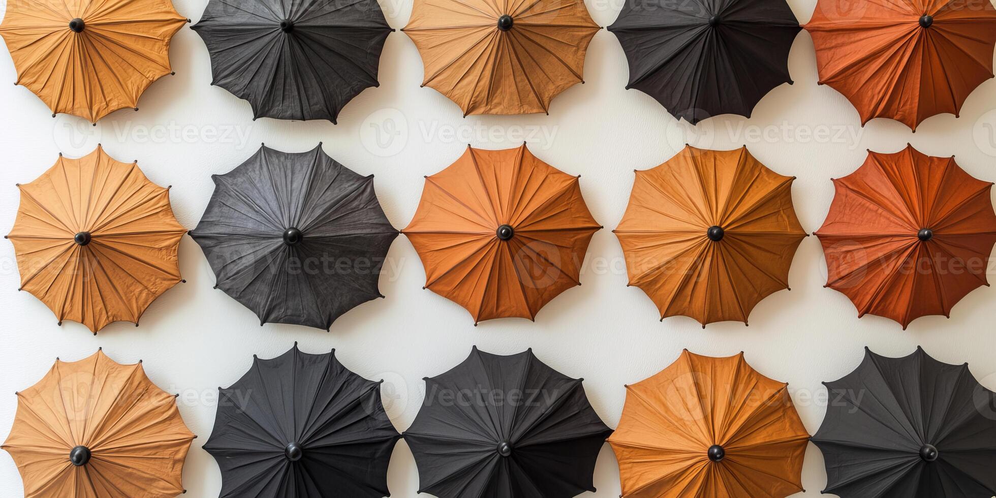 Colorful Pattern of Umbrellas on Display Against a White Wall photo
