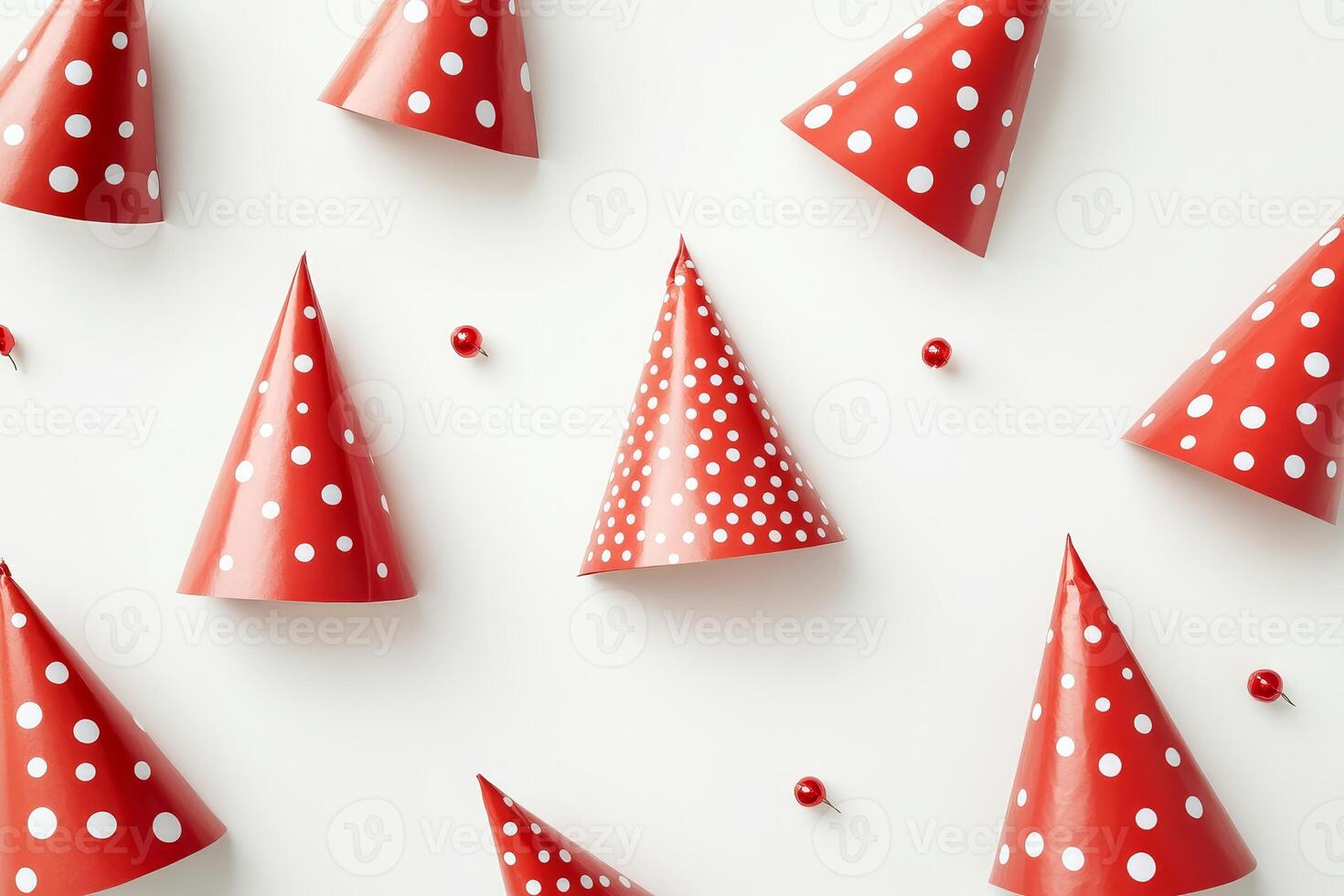 Red Polka Dot Party Hats and Pins on White Background photo