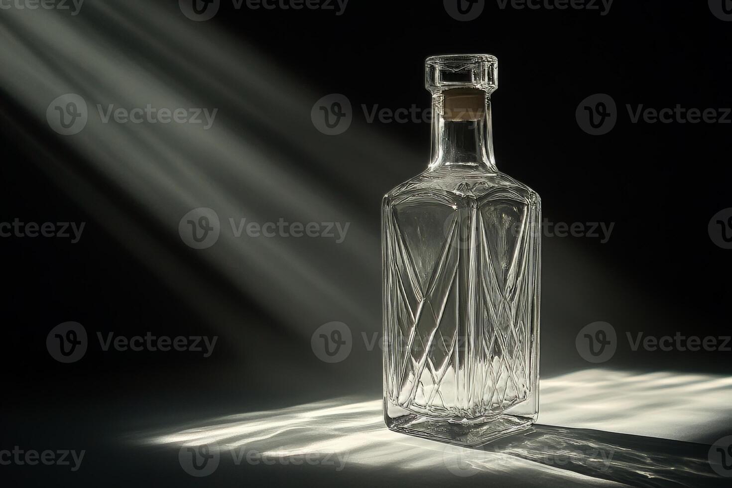 A bottle of liquor is sitting on a table photo