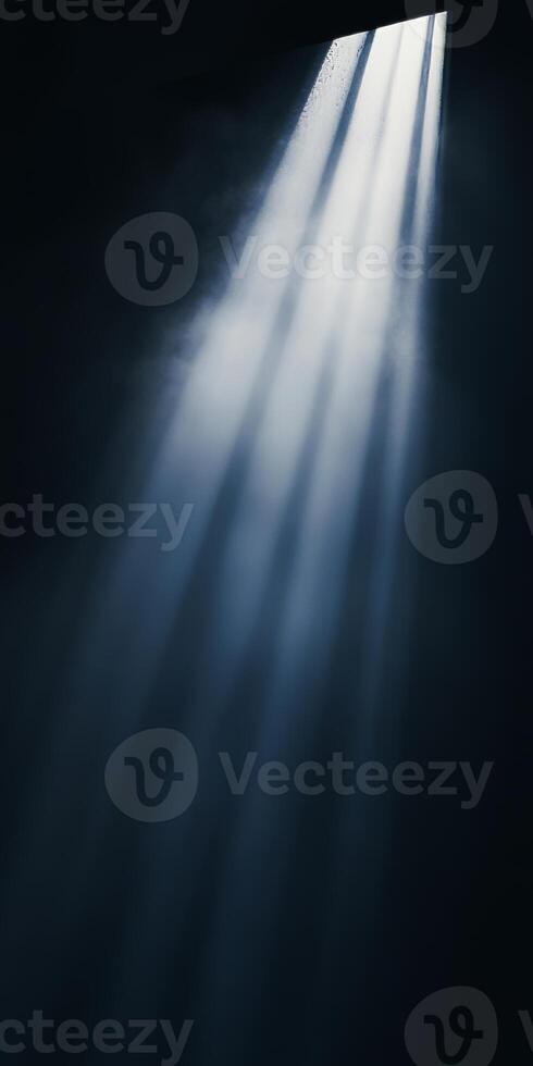 Rays of light piercing through a dark space, creating a mysterious and atmospheric ambiance. photo