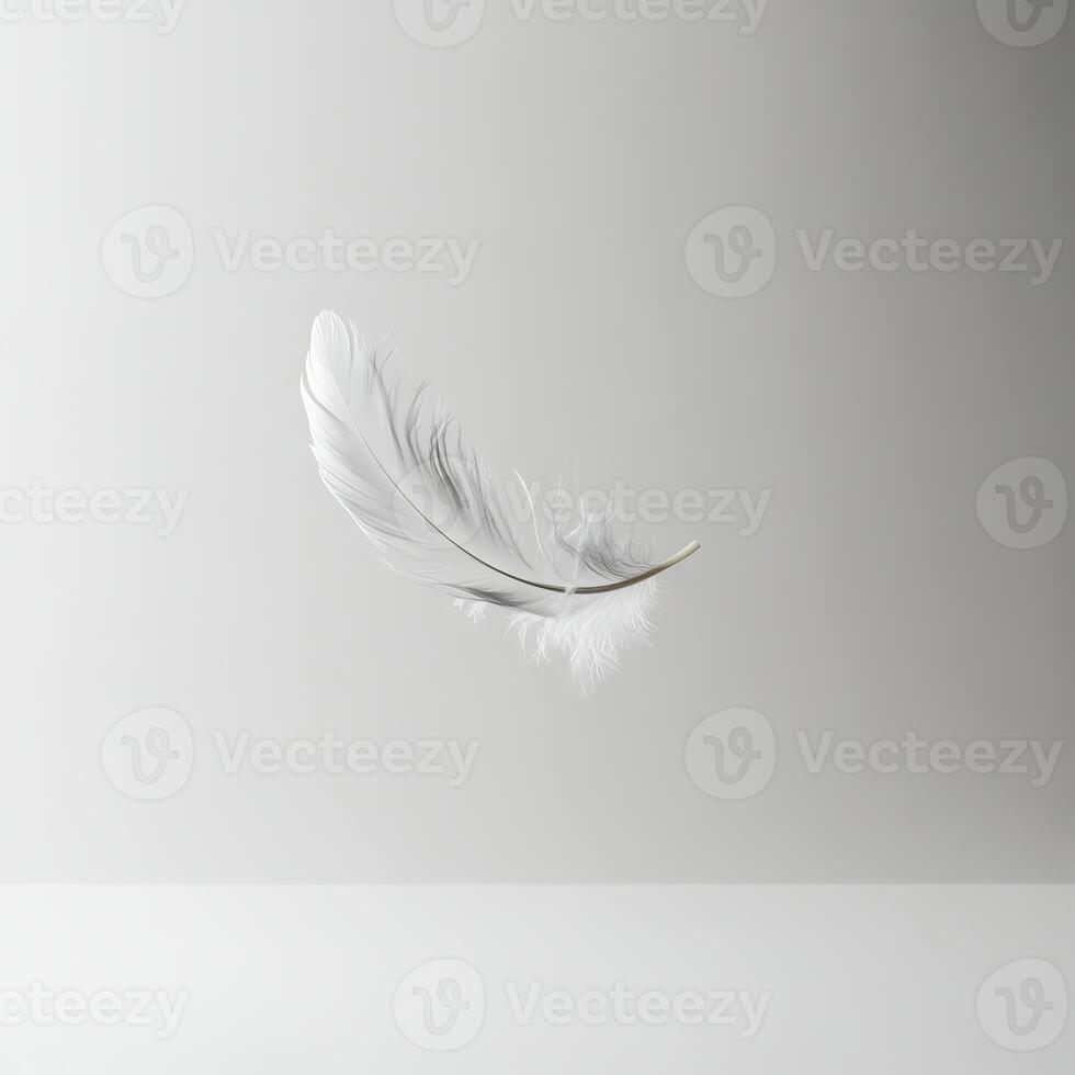 A white feather is floating in the air. The feather is light and delicate, and it seems to be floating effortlessly photo