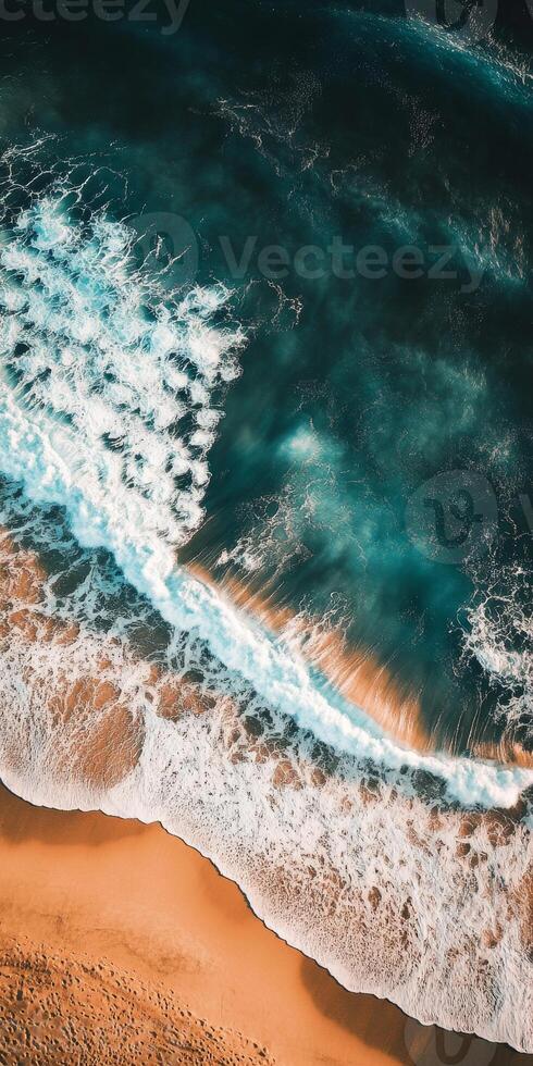The ocean is calm and the waves are small. The water is blue and the sky is clear photo