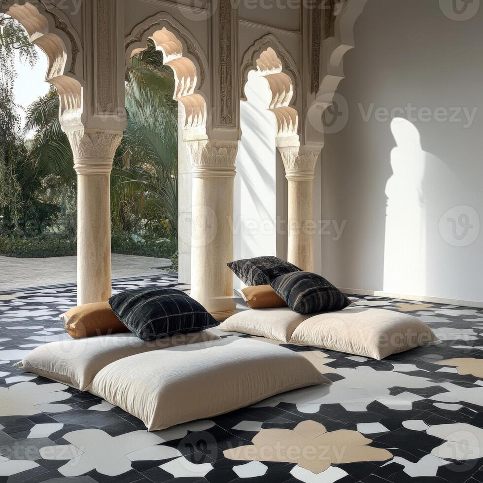 Two white pillows are placed on the floor in front of two pillars. The pillows are arranged in a way that they are facing each other photo