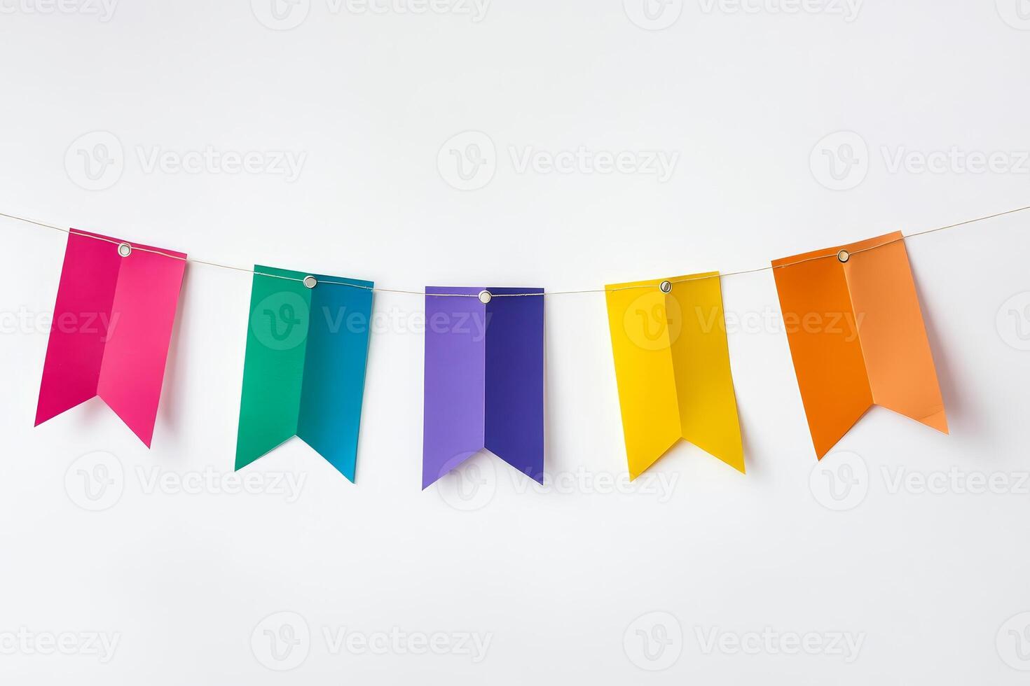 Vibrant paper banners in rainbow colors hanging on a string, perfect for celebrations and creative decor. photo