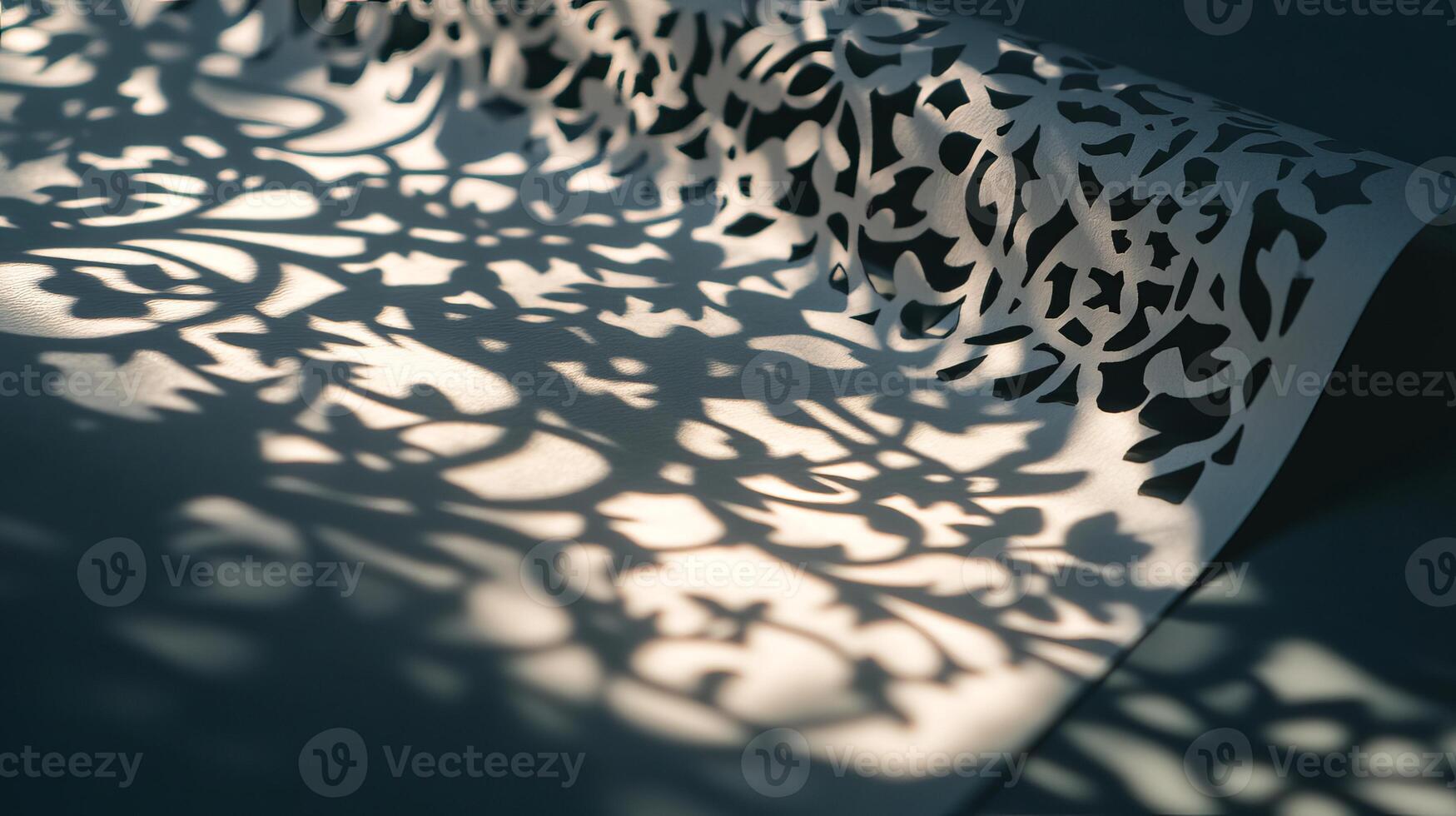 Intricate Paper Cut Art Casting Decorative Shadows on a Surface in Soft Ambient Light photo