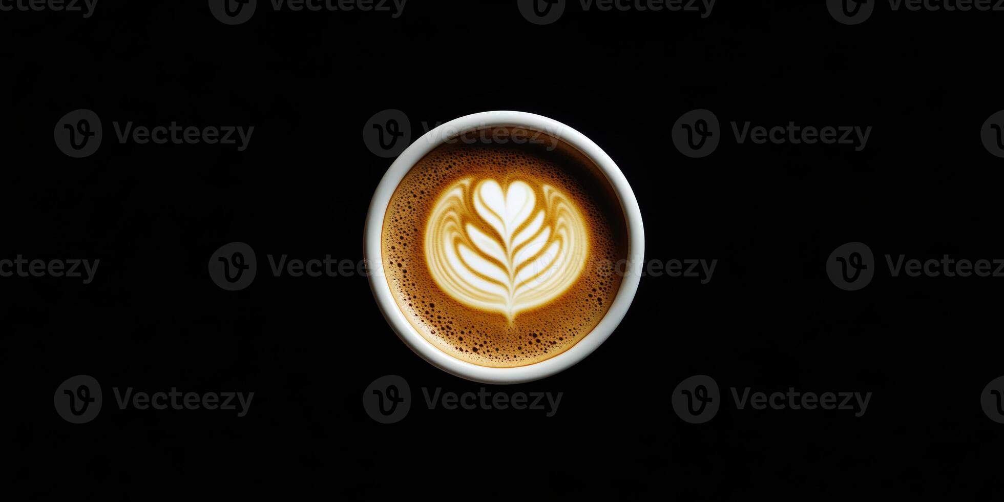 Creamy latte art with heart design in a round cup on dark background photo