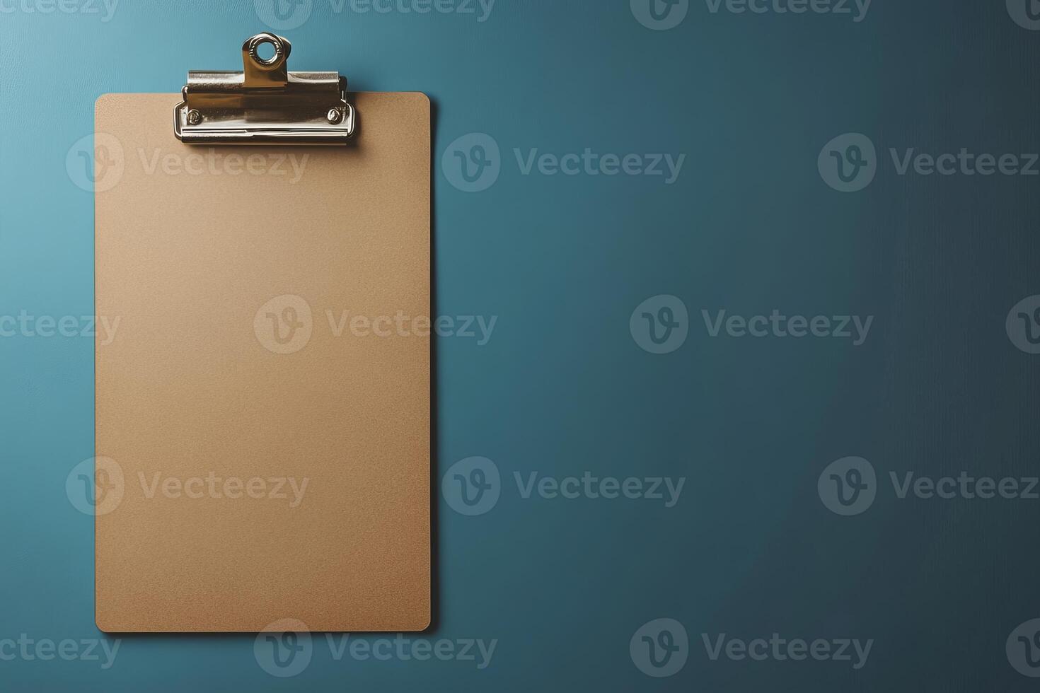 A clipboard is hanging on a wall photo