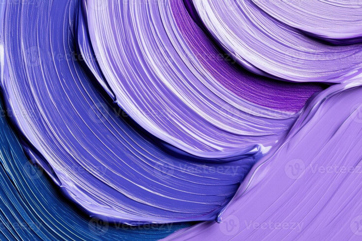 Close-up view of an artists palette showcasing vibrant lavender and deep blue paint swirls photo