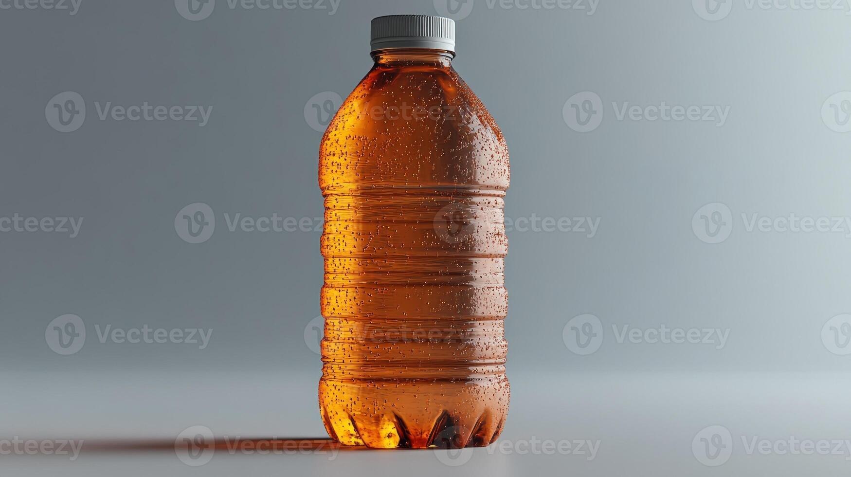 A dewy bottle displays golden drink inside, inviting thirst photo