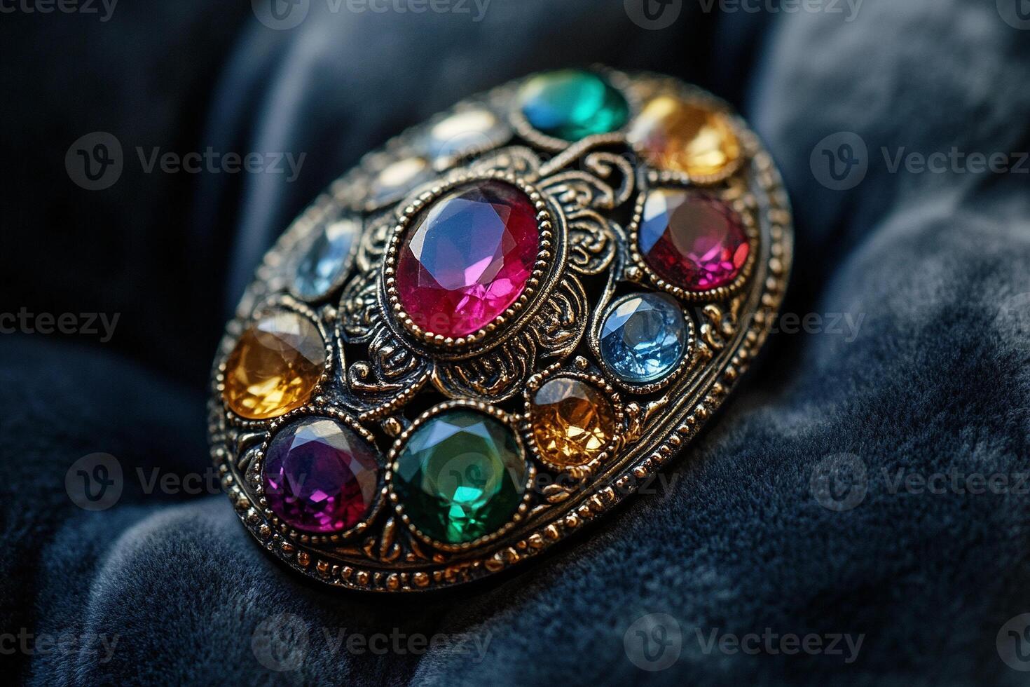 Macro photography of vintage brooch with colorful gemstones in ornate gold filigree setting on velvet fabric background photo