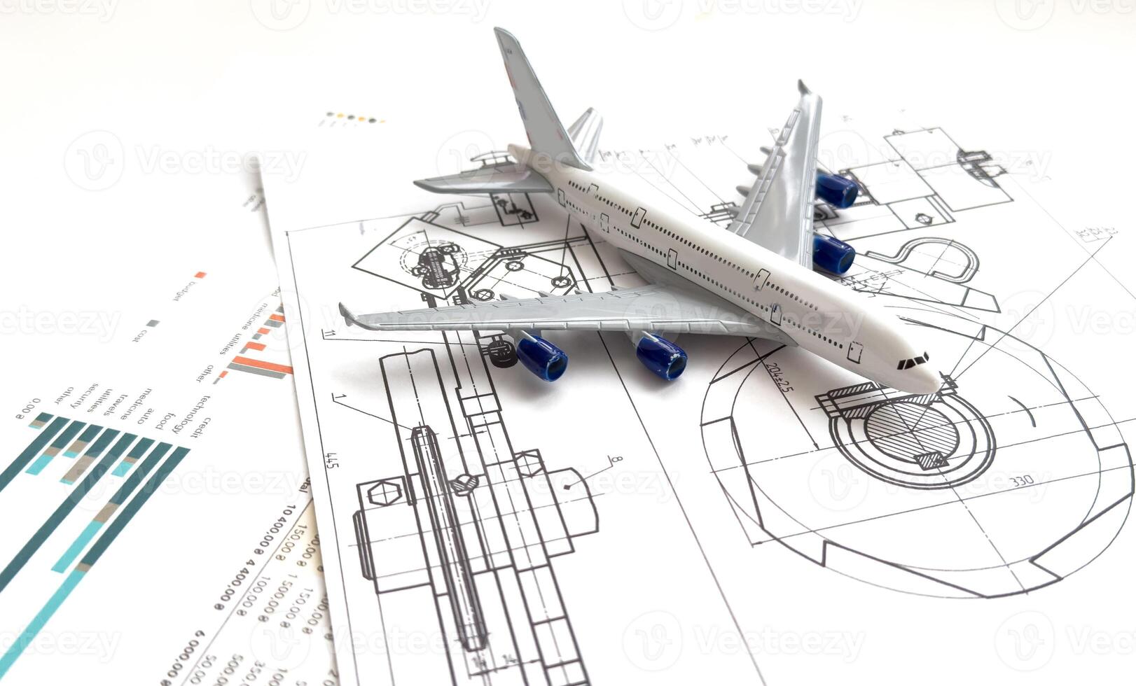Image of passenger airplane and engineering blueprint photo