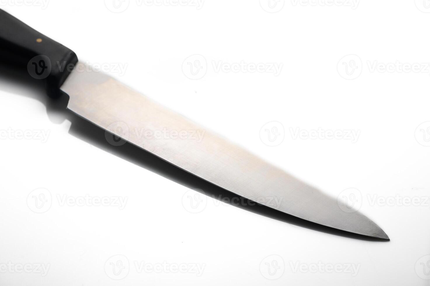 Sharp stainless steel chef knife gleaming with precision in bright light photo