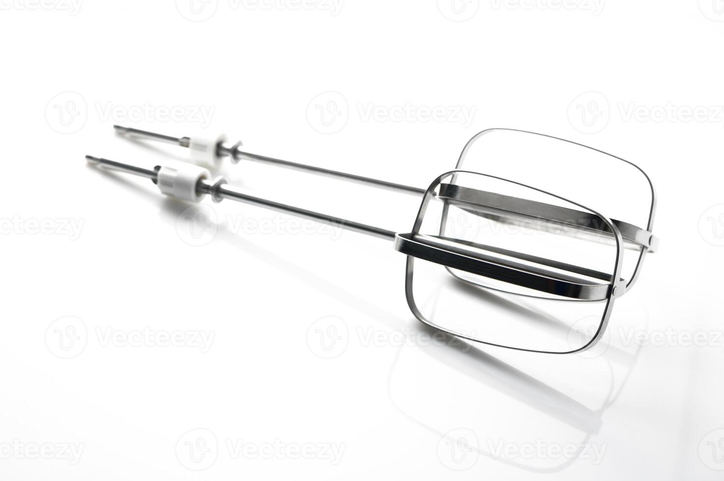 Whisks glimmering under bright light showcasing their sleek design and functionality for culinary adventures photo
