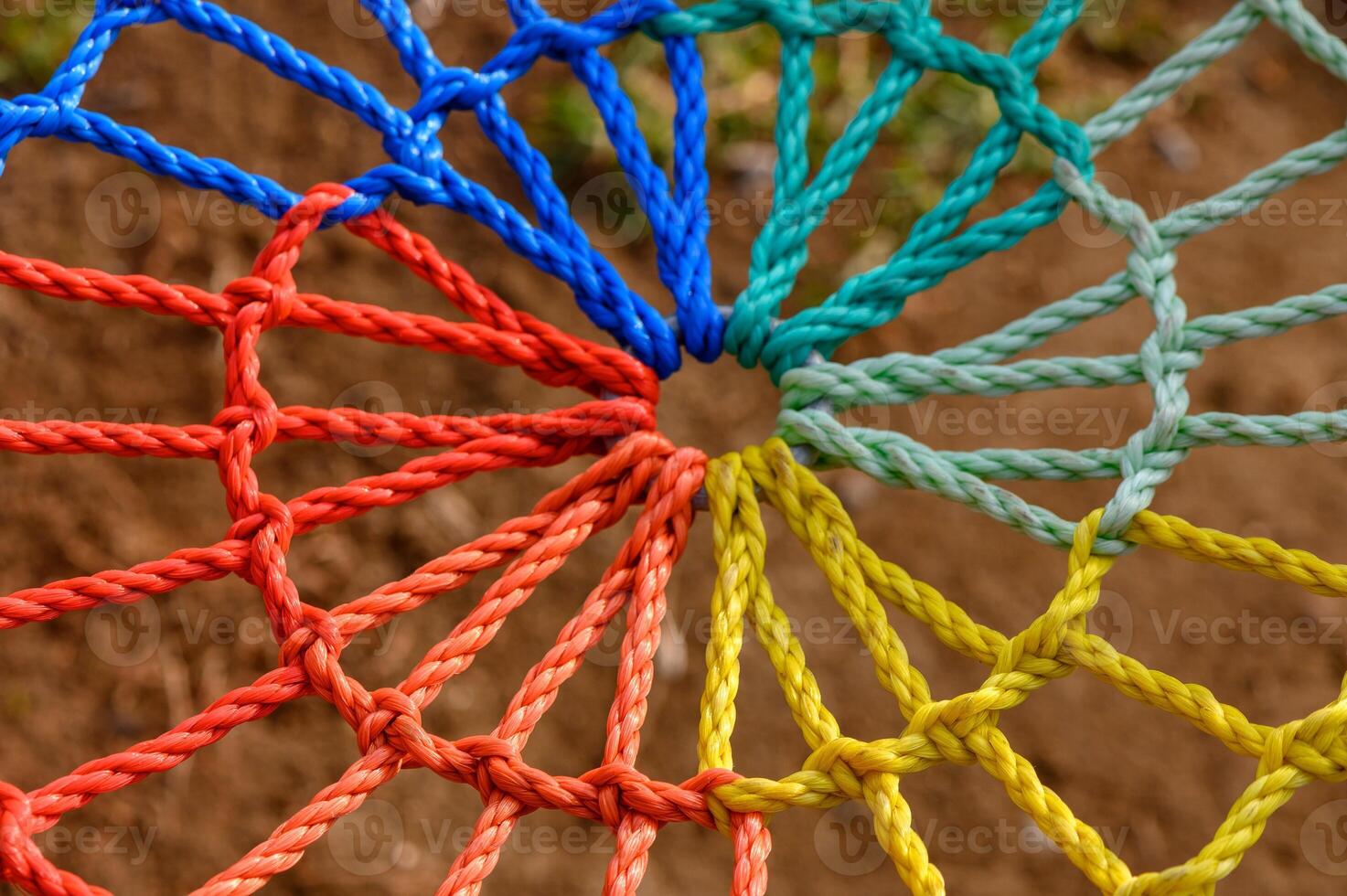 Colorful knots intertwine in a vibrant rope structure creating an artistic web of creativity photo