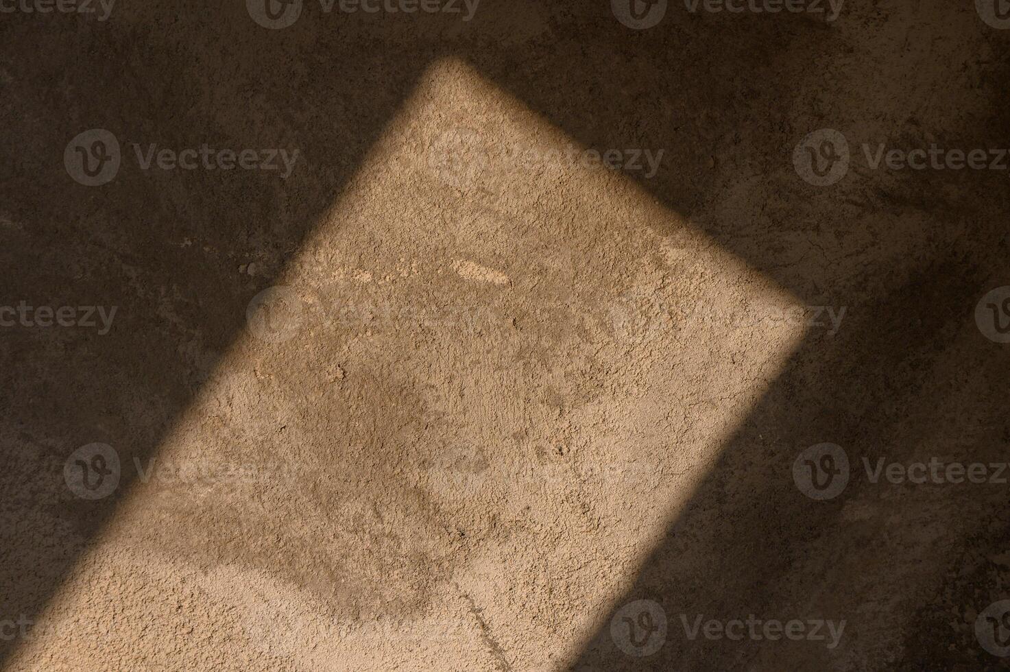 Sunlight casts a warm glow on a textured surface creating a tranquil, reflective moment in the room photo