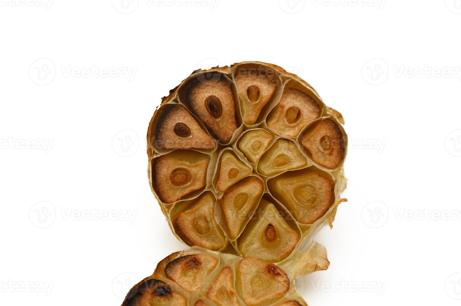 Unique roasted garlic bulb revealing intricate patterns and textures, capturing culinary artistry in action photo