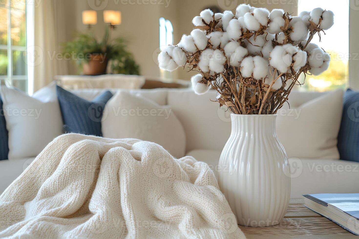 Cozy Living Room Decor with Cotton Bouquet and Knit Blanket for Relaxing Interior Design photo
