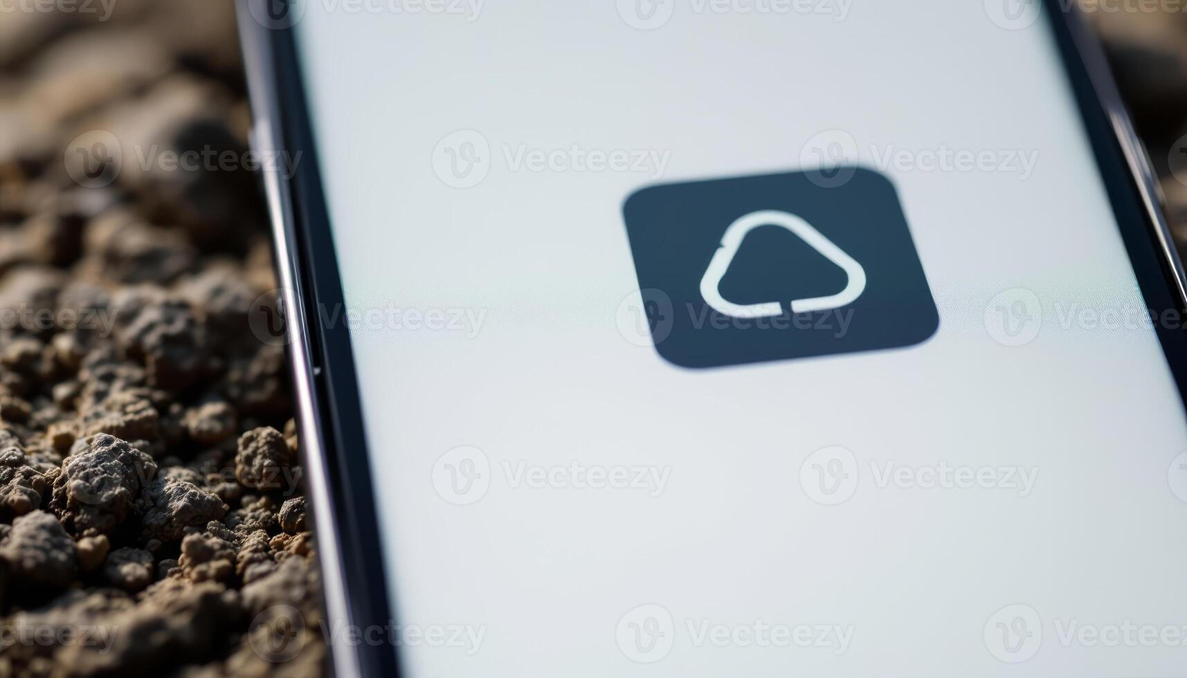Cloud Storage App Icon Displayed on a Smartphone Screen with a Textured Background photo