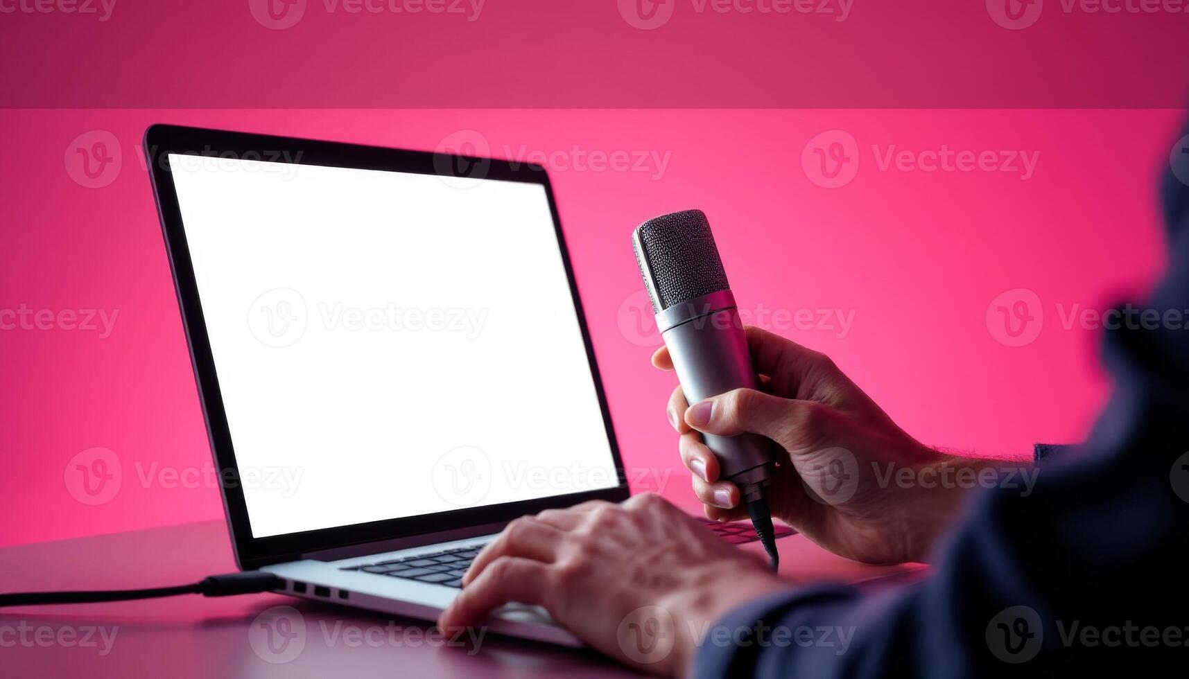 Recording a Podcast or Livestream with Microphone and Laptop in Studio Setup photo