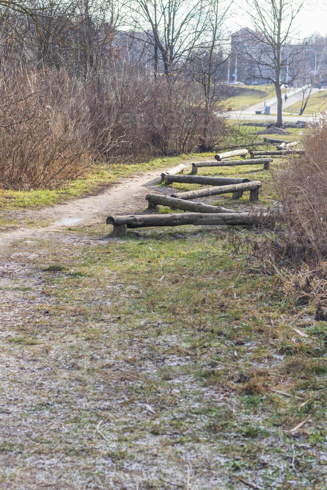 Wooden logs as a element of physical exercise equipment in the park. Lifestyle photo