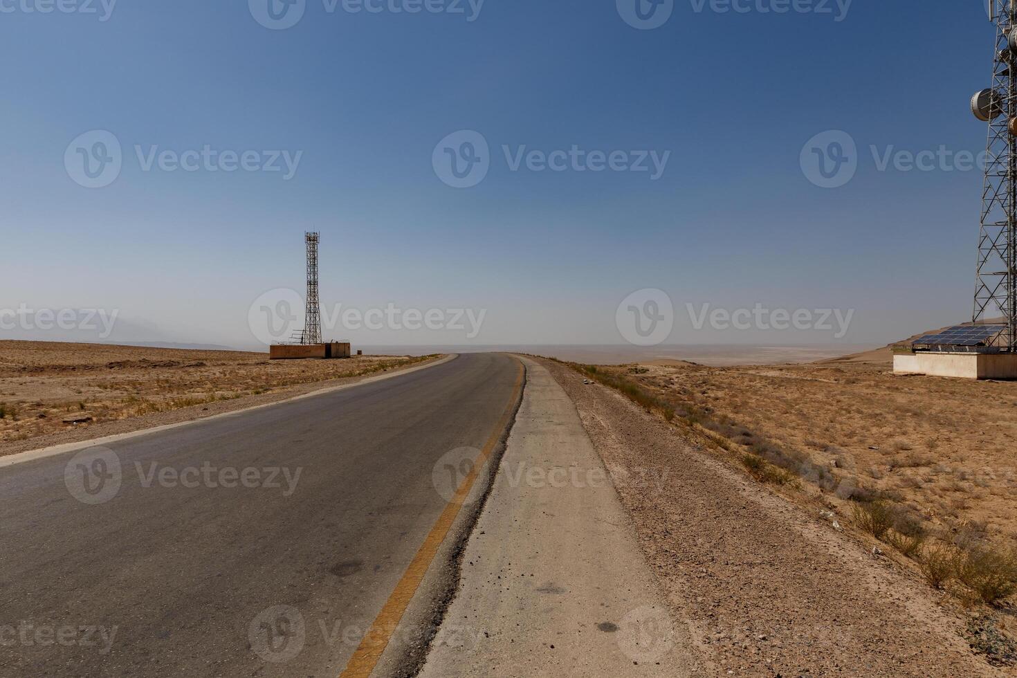 Vast landscape view along a deserted road in Kunduz Province, Afghanistan photo