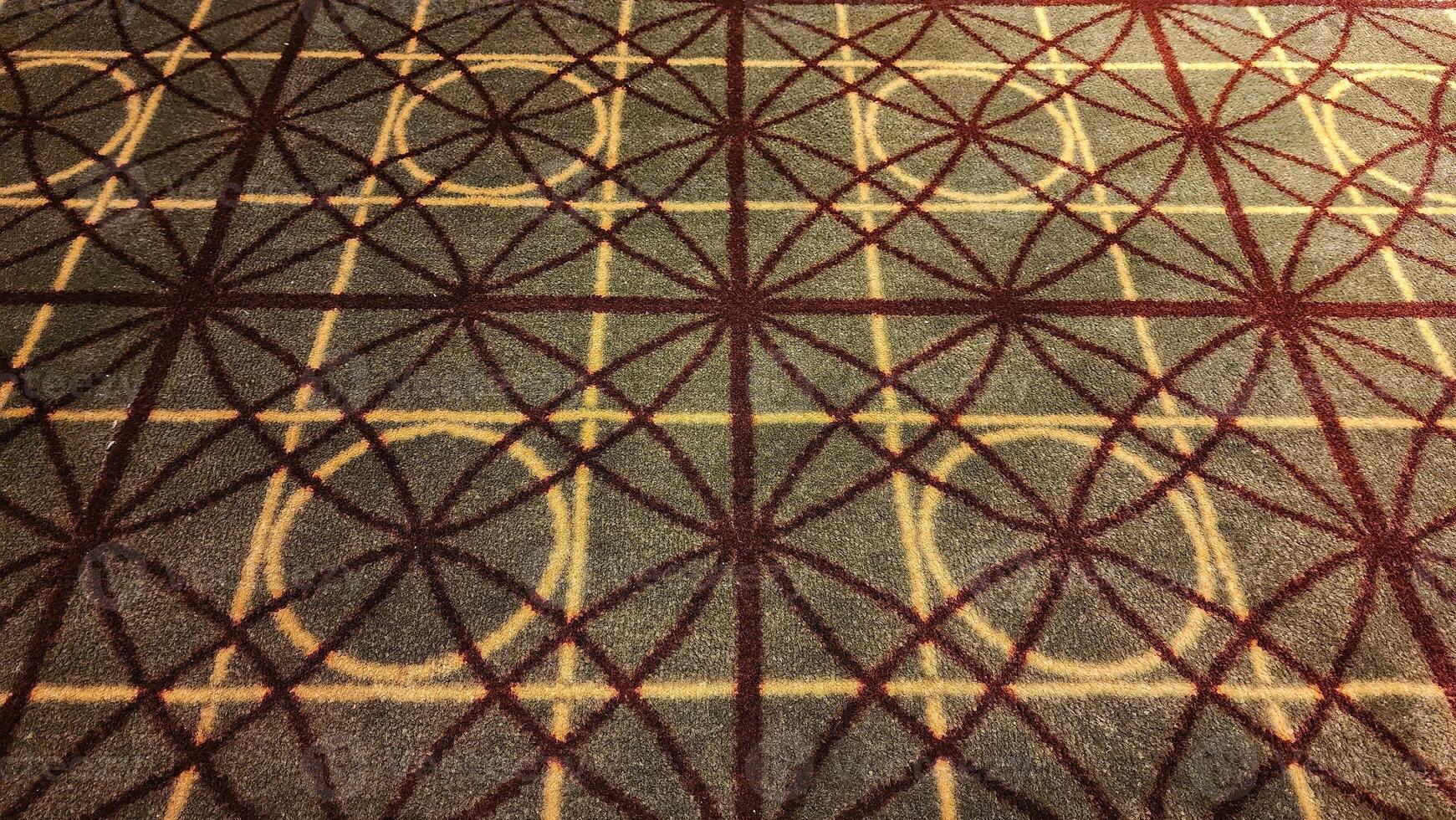Texture, background, pattern. The fabric is brown with a red pattern. photo