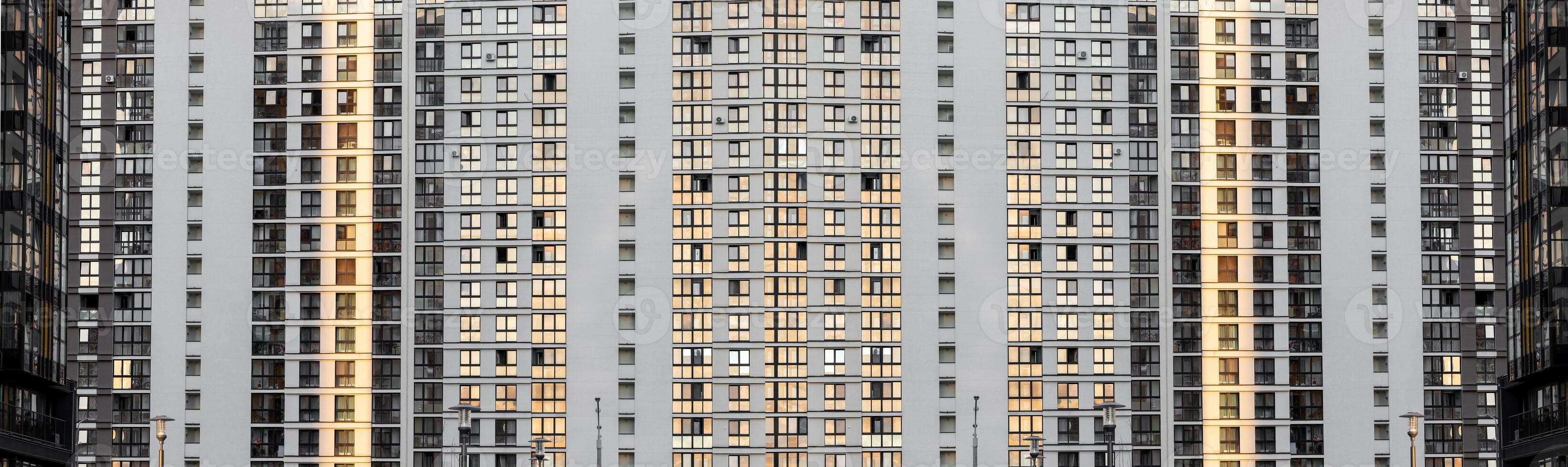 Urban window facade. Seamless pattern of a modern residential building with rows of identical photo