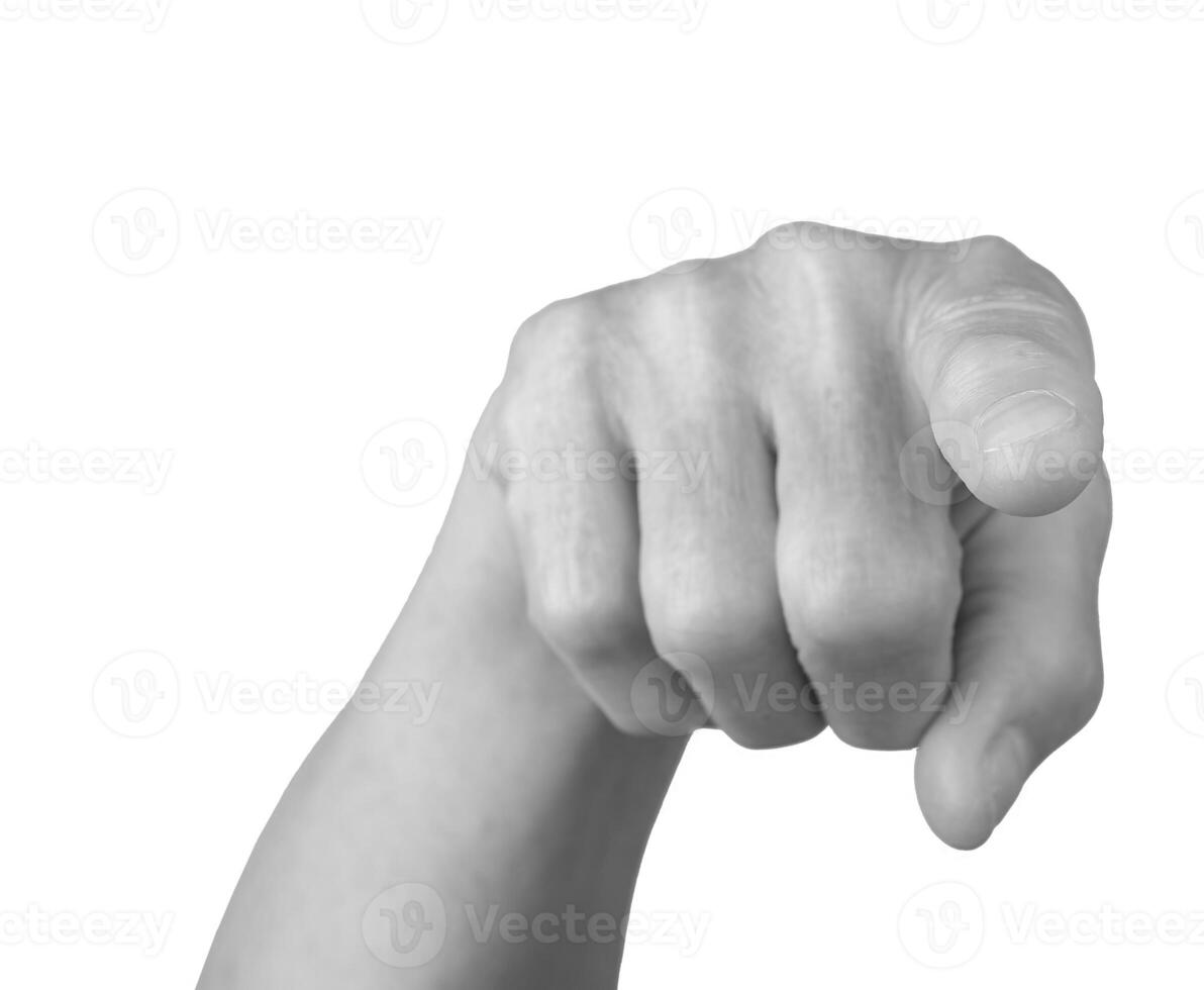 Pointing gesture. Senior woman s gray, wrinkled hand with the index finger extended, indicating photo