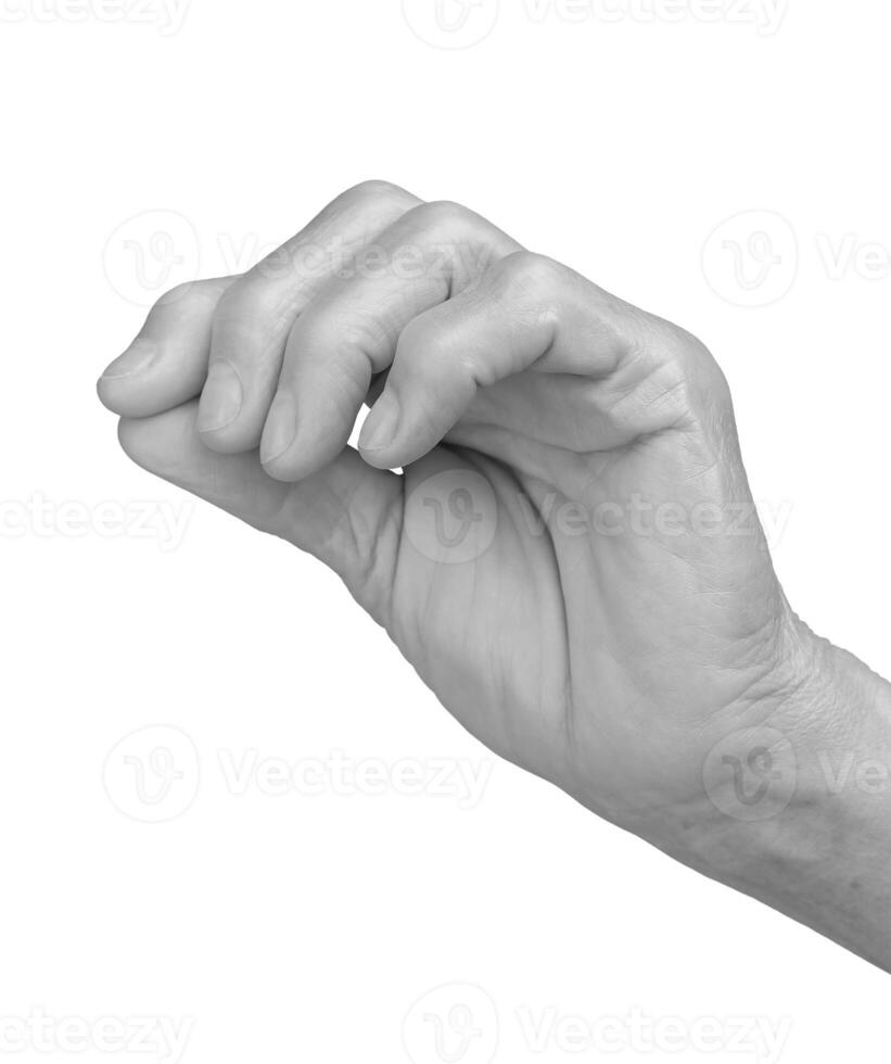 Hand with cross gesture. Senior woman s wrinkled hand holding a small sacred cross between thumb and photo
